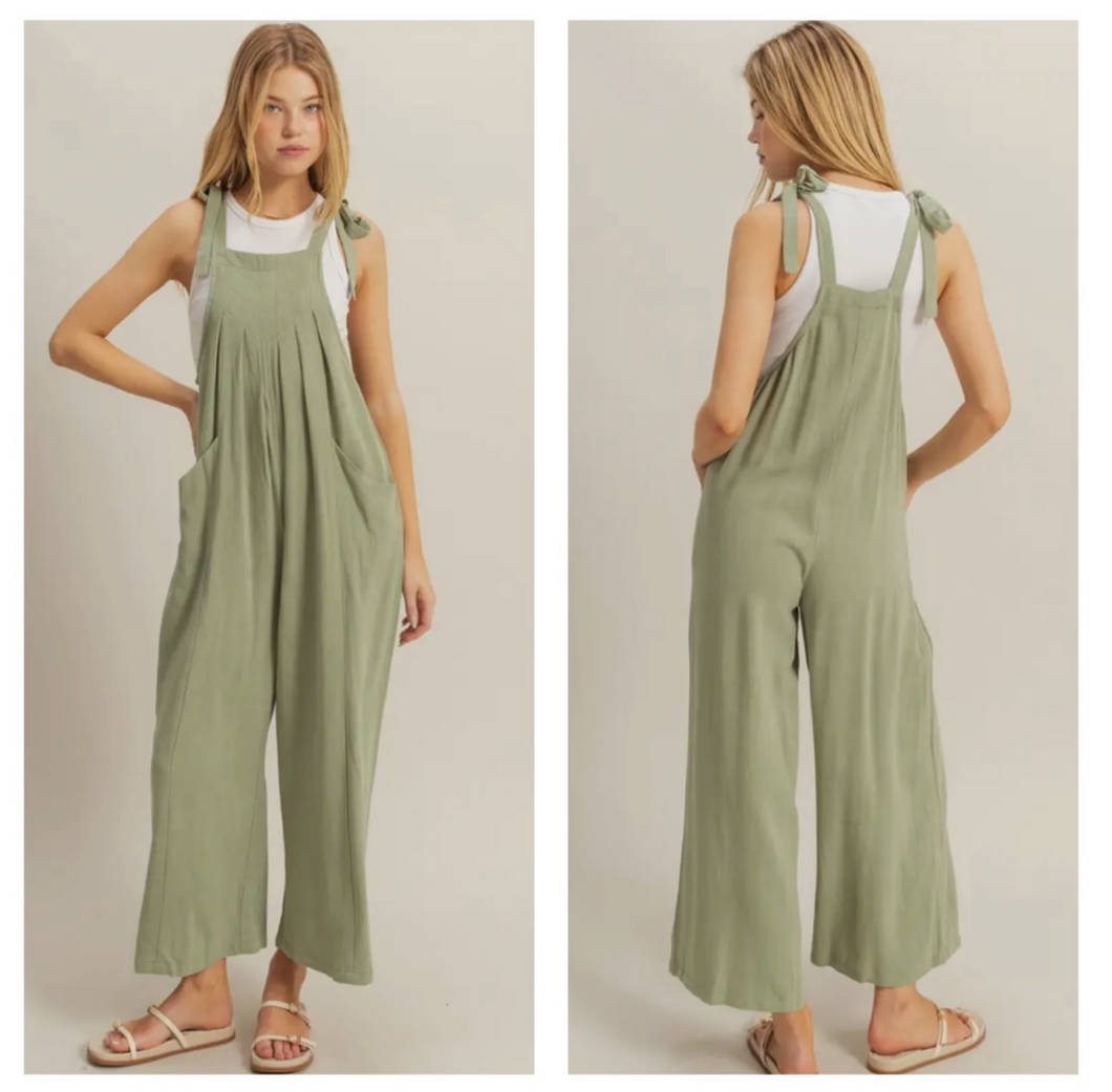 Sage green linen overalls with bow tie strap