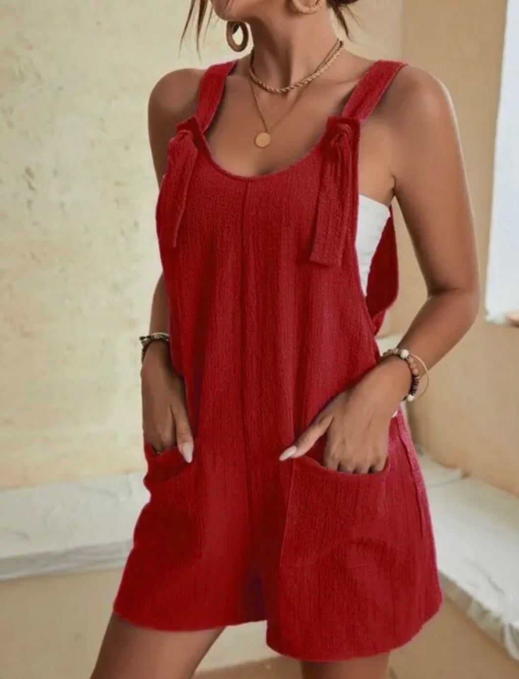 Red romper with bow tie straps