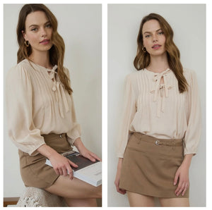 Cream 3/4 sleeve top with bow tie front