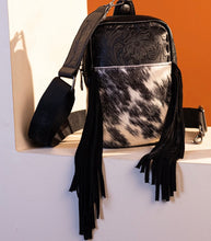 Load image into Gallery viewer, Black &amp; white tooled cowhide sling Trinity Ranch
